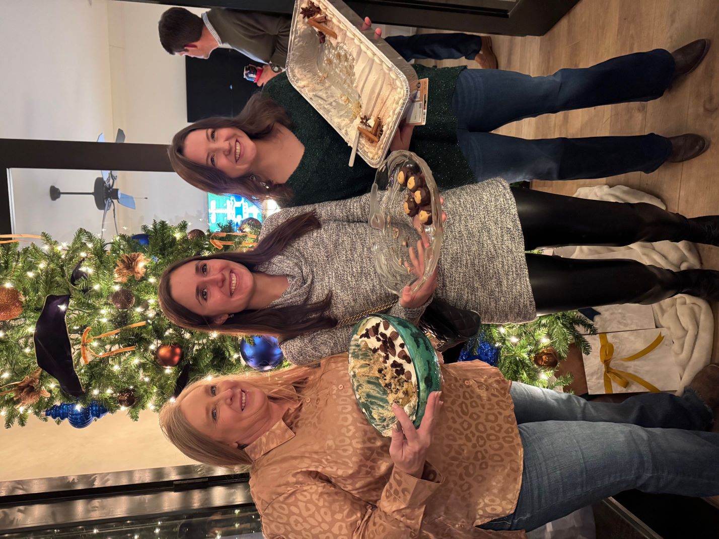 Melissa Burt (CMA, pictured left) Dr. Sarah Eley (PGY2),and Dr. Hollis Burrow’s (PGY4) wife Abigail Burrow pictured with their desserts.